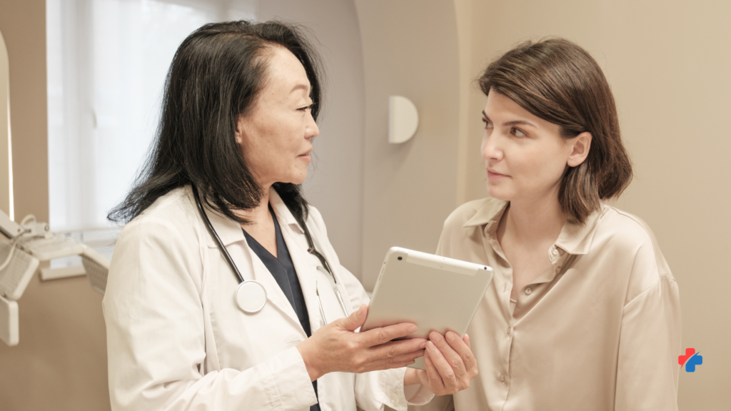 Doctor speaking with a patient about symptoms—when to seek help for stress and when to see a doctor for new or worsening symptoms