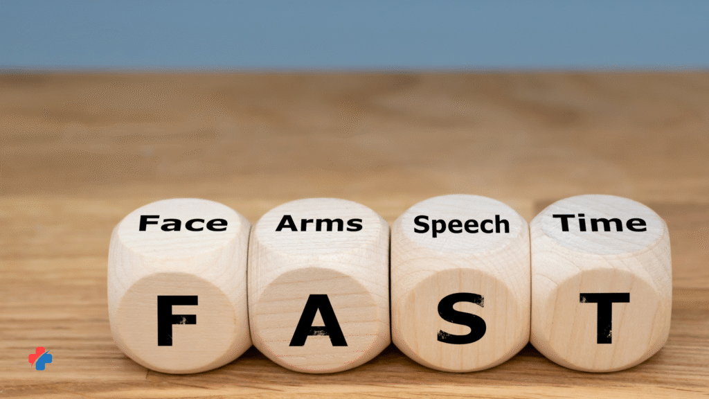 square wooden blocks on a table with F (Face), A (arms), S (speech), T(time) written on them which is an Acronym for Stroke Symptoms