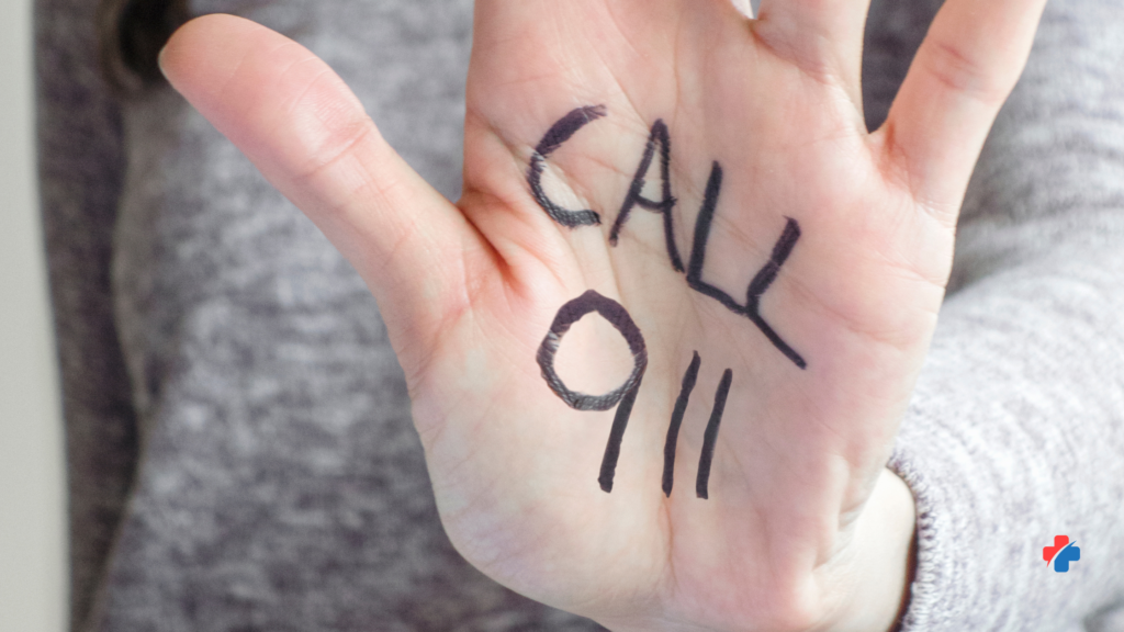 Hand with call 911 written to highlight seizure emergency warning signs